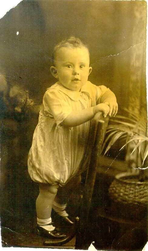 Original sepia photograph with creases and damage