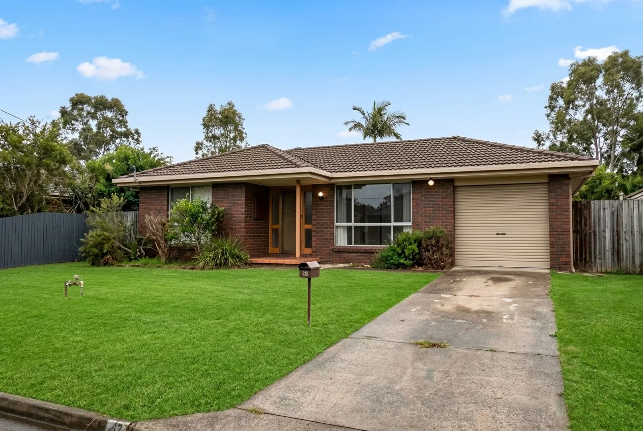 Enhanced real estate listing photo of a suburban home with a bright blue sky and vibrant lawn