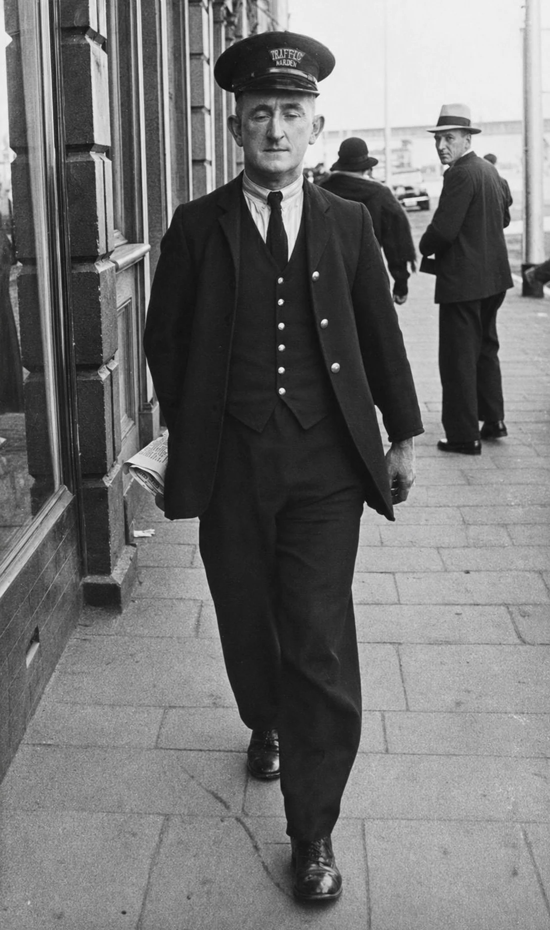 A restored vintage photograph of a 1940s traffic warden walking — ready to be animated into a cinematic clip